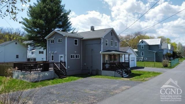 57 Bushnell Ave, Catskill, NY 12414 - view of front facade with a wooden deck, a residential view, and stairway