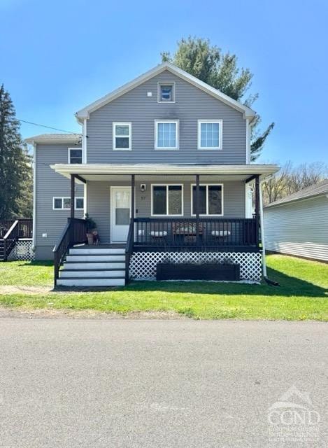 57 Bushnell Ave, Catskill, NY 12414 - view of front of property with a porch and a front lawn
