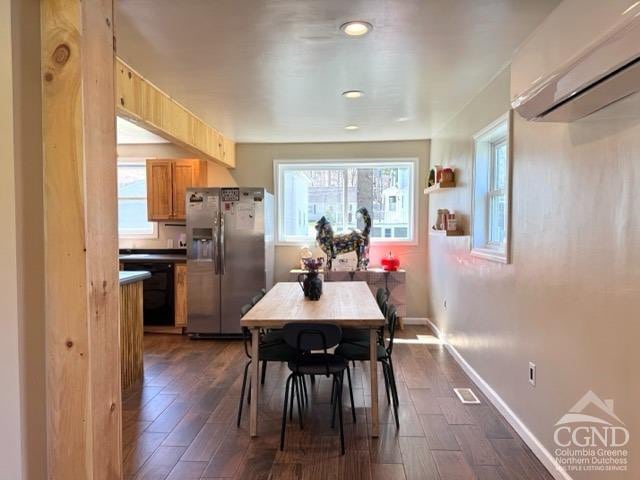 57 Bushnell Ave, Catskill, NY 12414 - dining space featuring a wall mounted AC, dark wood finished floors, baseboards, and recessed lighting