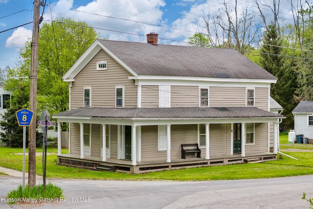 1 Green St, Gilbertsville, NY 13776 - farmhouse-style home featuring covered porch, a chimney, and a front yard