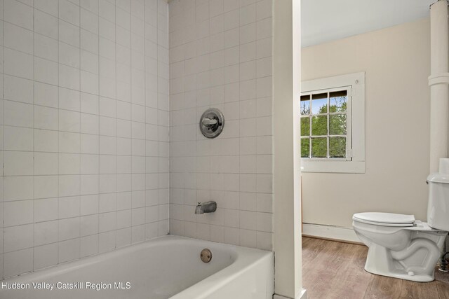 1 Green St, Gilbertsville, NY 13776 - full bathroom with toilet, wood finished floors, and bathtub / shower combination