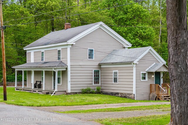 1 Green St, Gilbertsville, NY 13776 - view of front of home featuring a porch, a chimney, a front yard, and roof with shingles