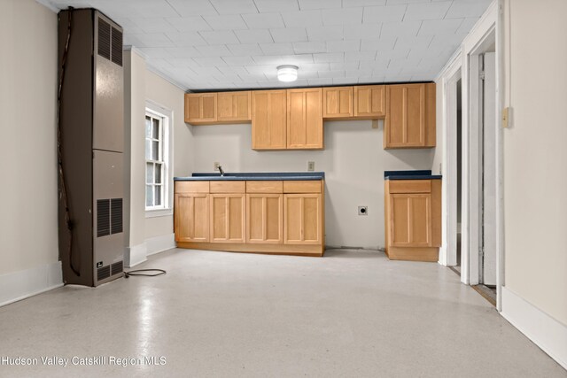 1 Green St, Gilbertsville, NY 13776 - kitchen with a heating unit, baseboards, and a sink