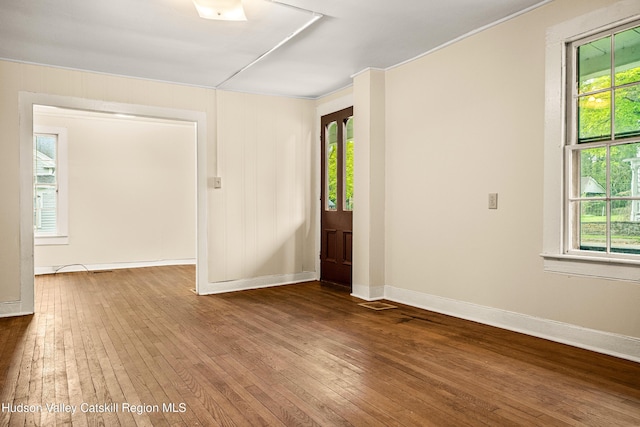 1 Green St, Gilbertsville, NY 13776 - unfurnished room with wood-type flooring and baseboards