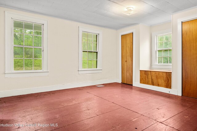 1 Green St, Gilbertsville, NY 13776 - spare room with baseboards and ornamental molding