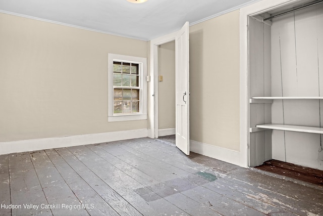 1 Green St, Gilbertsville, NY 13776 - unfurnished bedroom featuring wood-type flooring, baseboards, and ornamental molding