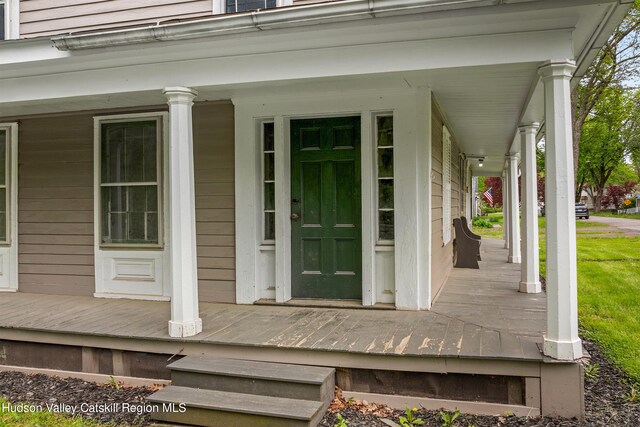 1 Green St, Gilbertsville, NY 13776 - property entrance with covered porch