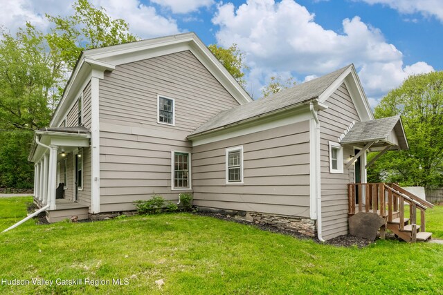 1 Green St, Gilbertsville, NY 13776 - back of house with a lawn