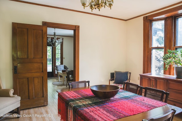 121 Birch Creek Rd, Pine Hill, NY 12465 - dining room featuring a chandelier, ornamental molding, and light wood-style flooring