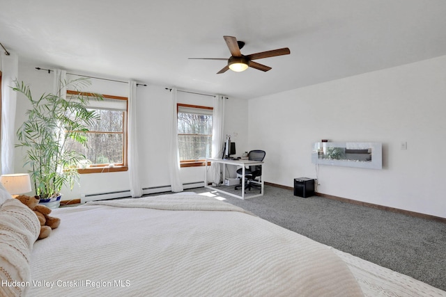 bedroom with baseboards, baseboard heating, and carpet flooring