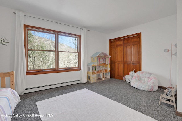 bedroom featuring a baseboard radiator, a closet, and carpet floors