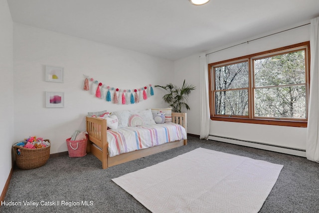 carpeted bedroom featuring baseboards and a baseboard heating unit