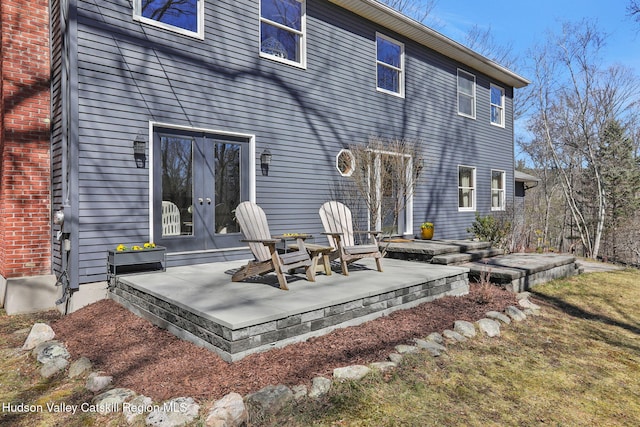 back of property with a patio and french doors