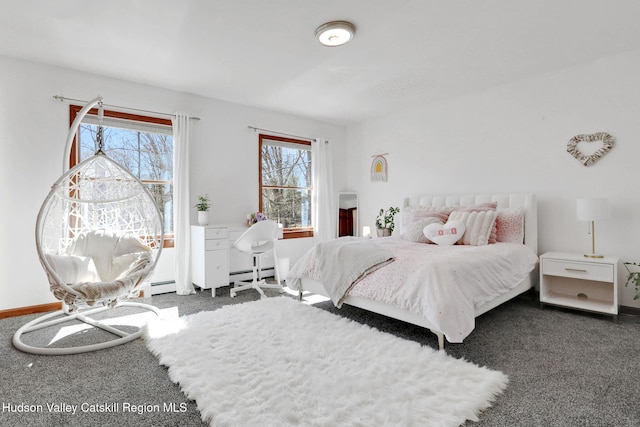 carpeted bedroom featuring baseboards and baseboard heating