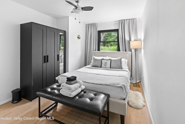 2064 County Highway 8, Denver, NY 12421 - bedroom featuring light wood-style flooring and a ceiling fan
