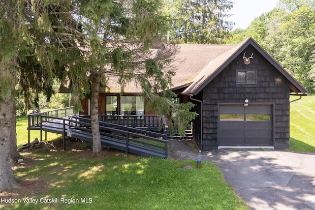 2064 County Highway 8, Denver, NY 12421 - view of front of property featuring driveway, a garage, a deck, a front lawn, and roof with shingles
