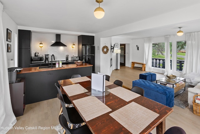 2064 County Highway 8, Denver, NY 12421 - dining room featuring light wood-style flooring