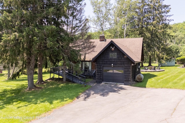 2064 County Highway 8, Denver, NY 12421 - view of front of house featuring asphalt driveway, roof with shingles, a chimney, a front lawn, and an attached garage