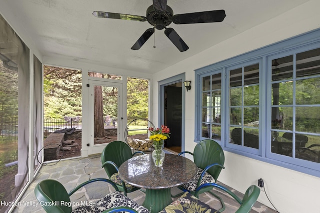 253 Upper Byrdcliffe Rd, Woodstock, NY 12498 - sunroom featuring stone floors, ceiling fan, and outdoor dining space