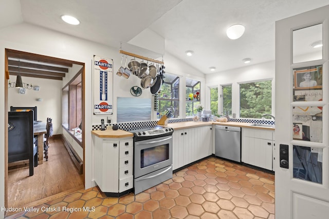 253 Upper Byrdcliffe Rd, Woodstock, NY 12498 - kitchen with appliances with stainless steel finishes, lofted ceiling, white cabinets, a baseboard radiator, and recessed lighting