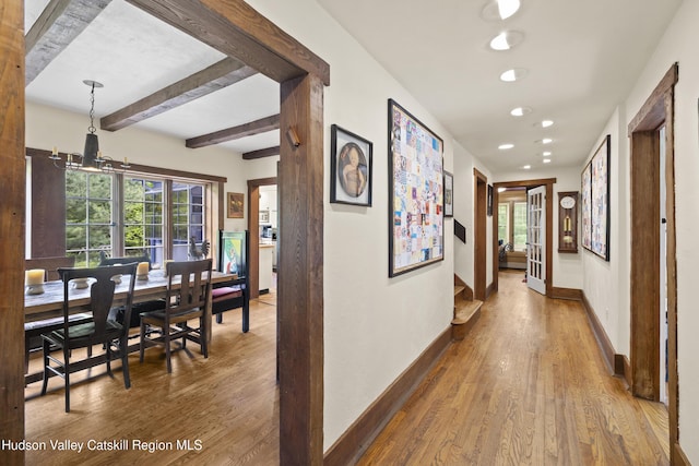 253 Upper Byrdcliffe Rd, Woodstock, NY 12498 - hall featuring wood finished floors, beam ceiling, baseboards, recessed lighting, and plenty of natural light