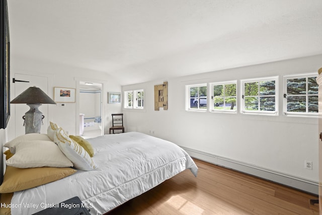 253 Upper Byrdcliffe Rd, Woodstock, NY 12498 - bedroom featuring baseboard heating and wood finished floors