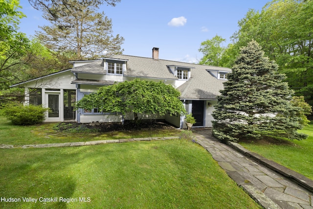 253 Upper Byrdcliffe Rd, Woodstock, NY 12498 - view of front of home featuring a chimney, roof with shingles, and a front lawn
