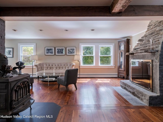 236 Spillway Rd, West Hurley, NY 12491 - living area with baseboard heating, hardwood / wood-style floors, a fireplace, beamed ceiling, and a baseboard heating unit