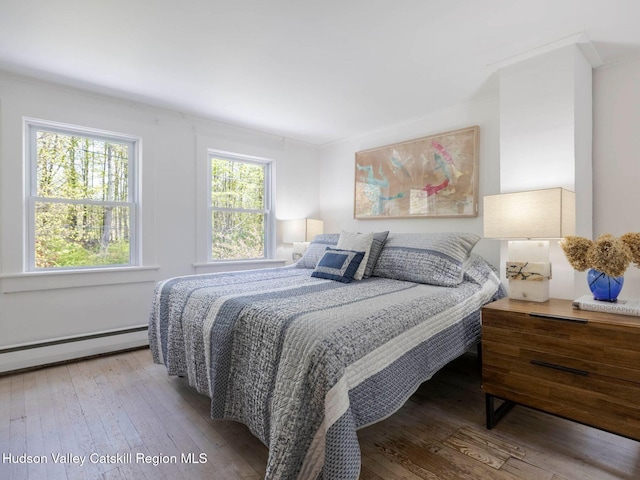 236 Spillway Rd, West Hurley, NY 12491 - bedroom featuring hardwood / wood-style floors, a baseboard radiator, and crown molding