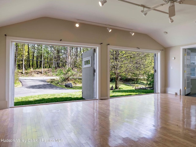 236 Spillway Rd, West Hurley, NY 12491 - doorway to outside with vaulted ceiling, a ceiling fan, wood finished floors, and track lighting