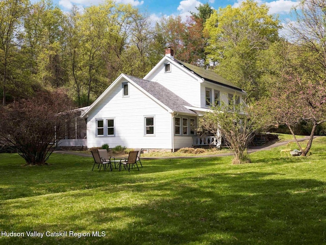 236 Spillway Rd, West Hurley, NY 12491 - back of property featuring a yard, a chimney, and a shingled roof