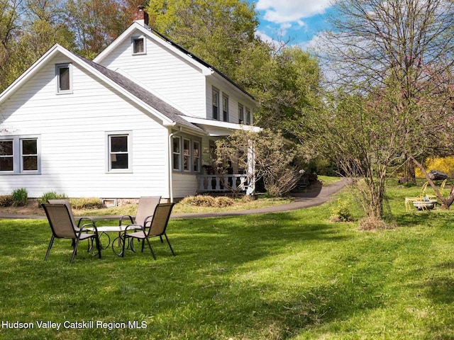 236 Spillway Rd, West Hurley, NY 12491 - back of property with a yard and a chimney
