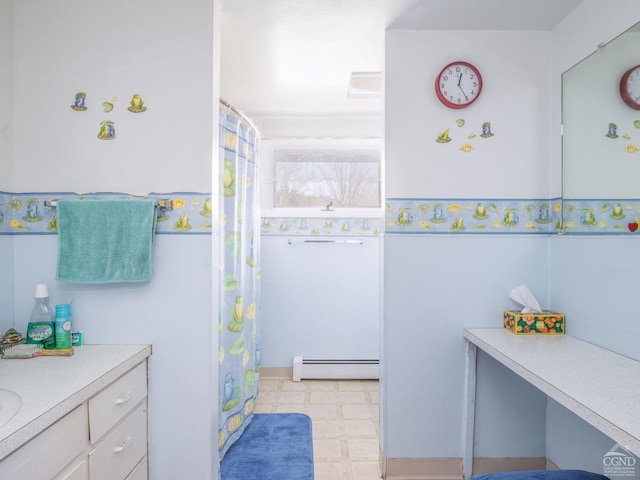 full bathroom featuring a baseboard heating unit, tile patterned floors, vanity, and a shower with shower curtain