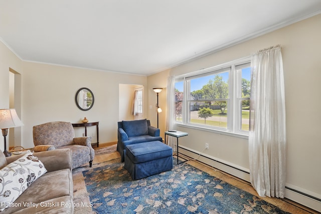 1 Huguenot Rd, Tillson, NY 12486 - living room featuring crown molding and a baseboard radiator