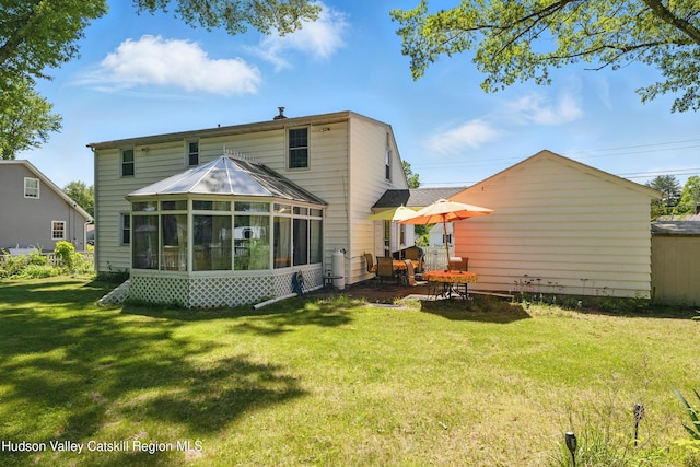 1 Huguenot Rd, Tillson, NY 12486 - rear view of house featuring a sunroom and a lawn