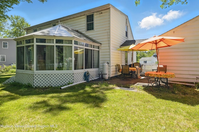 1 Huguenot Rd, Tillson, NY 12486 - rear view of property with a sunroom and a lawn