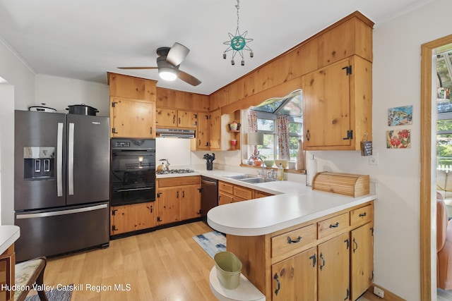 1 Huguenot Rd, Tillson, NY 12486 - kitchen with appliances with stainless steel finishes, a warming drawer, a sink, under cabinet range hood, and plenty of natural light