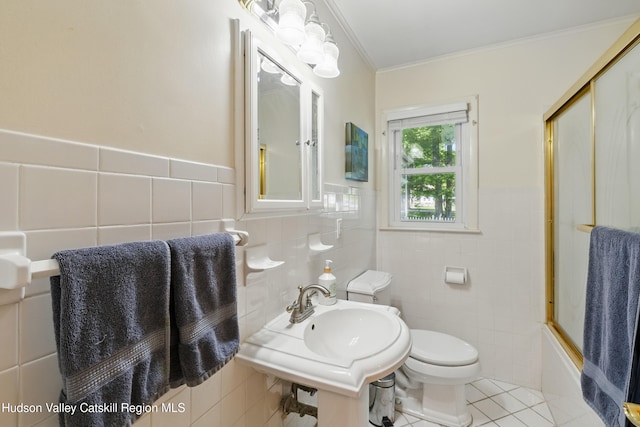 1 Huguenot Rd, Tillson, NY 12486 - bathroom with tile walls, toilet, ornamental molding, tile patterned flooring, and a sink