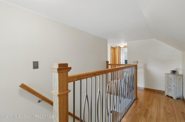 1 Huguenot Rd, Tillson, NY 12486 - hall with an upstairs landing, light wood-style floors, vaulted ceiling, and baseboards