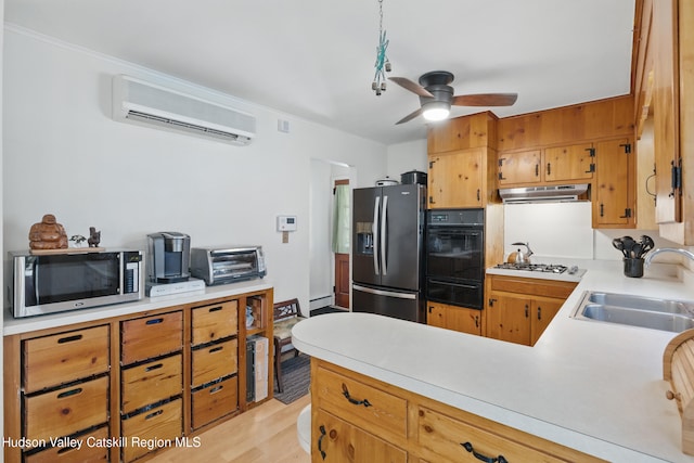 1 Huguenot Rd, Tillson, NY 12486 - kitchen with refrigerator with ice dispenser, stainless steel microwave, a sink, oven, and a wall mounted AC