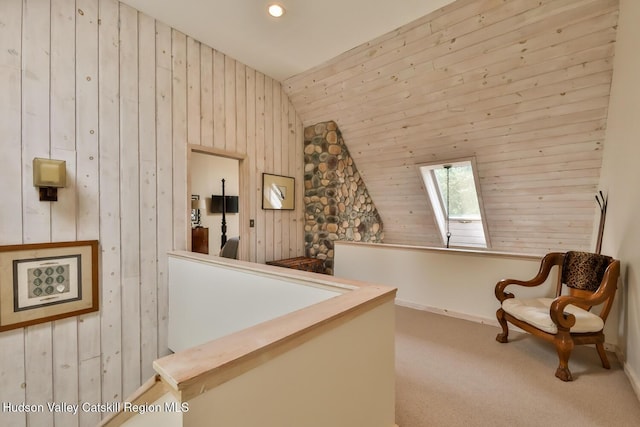 122 Brainard Ridge Rd Unit 14F, Windham, NY 12496 - living area with wooden walls, vaulted ceiling, a skylight, and carpet floors