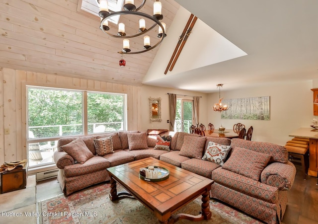 122 Brainard Ridge Rd Unit 14F, Windham, NY 12496 - living room featuring a chandelier, baseboard heating, high vaulted ceiling, wood finished floors, and wood walls