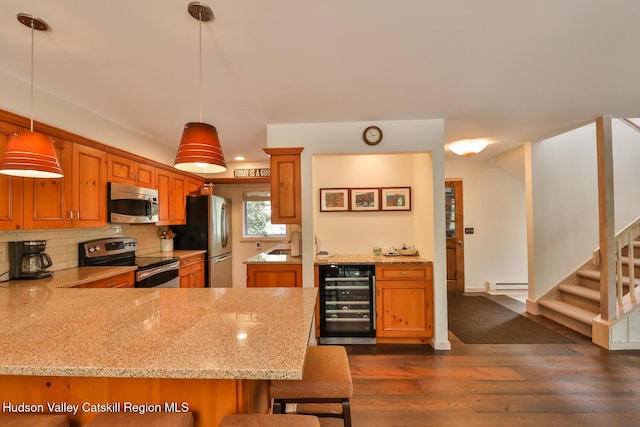 122 Brainard Ridge Rd Unit 14F, Windham, NY 12496 - kitchen featuring beverage cooler, stainless steel appliances, dark wood-type flooring, decorative backsplash, and a peninsula