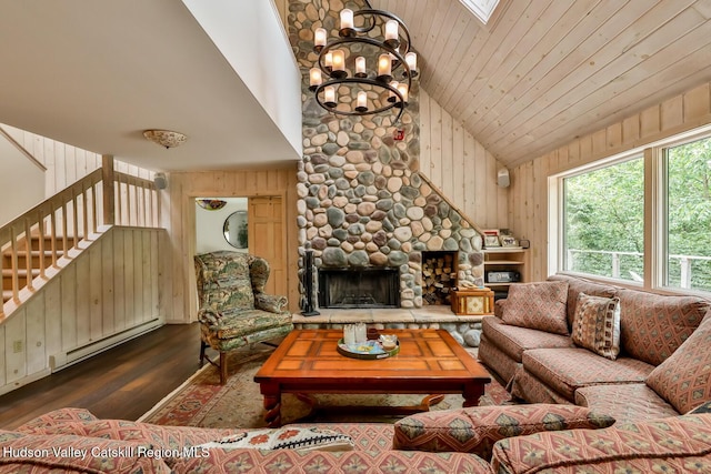 122 Brainard Ridge Rd Unit 14F, Windham, NY 12496 - living area featuring dark wood-style flooring, baseboard heating, a chandelier, stairway, and a fireplace