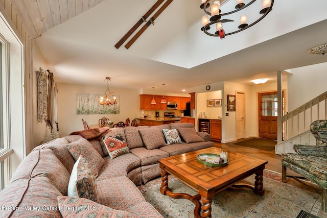 122 Brainard Ridge Rd Unit 14F, Windham, NY 12496 - living area featuring a chandelier, wood finished floors, stairs, high vaulted ceiling, and wood ceiling