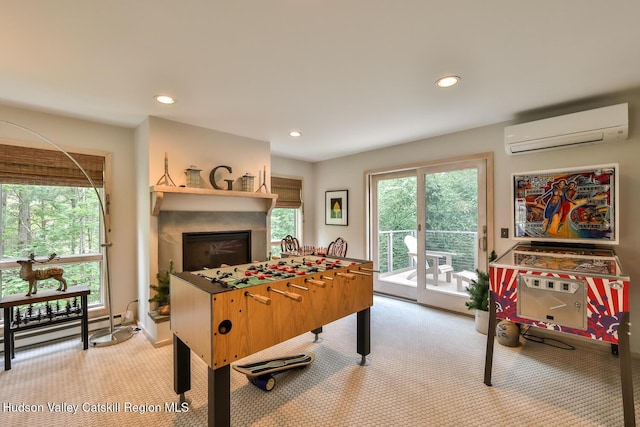 122 Brainard Ridge Rd Unit 14F, Windham, NY 12496 - playroom with light colored carpet, a fireplace, a wall mounted air conditioner, and recessed lighting