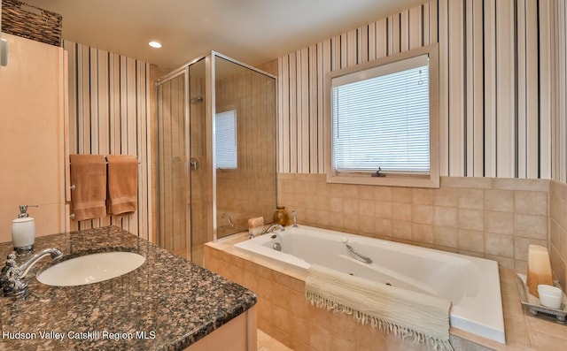 122 Brainard Ridge Rd Unit 14F, Windham, NY 12496 - bathroom with a shower stall, a tub with jets, recessed lighting, vanity, and wallpapered walls