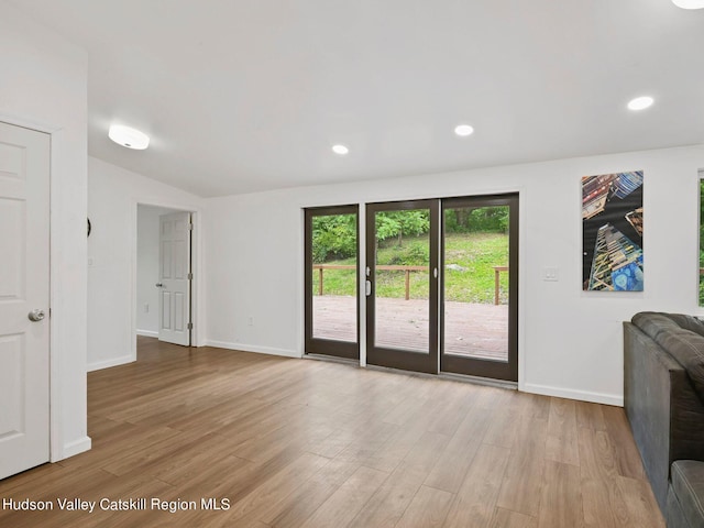 unfurnished living room featuring light wood-type flooring