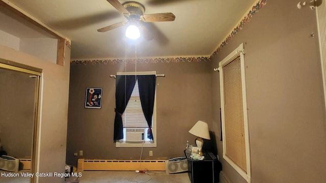 unfurnished bedroom featuring baseboard heating and ceiling fan