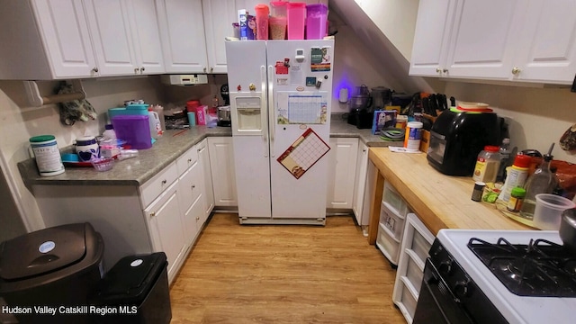 kitchen with light wood-type flooring, white appliances, and white cabinetry